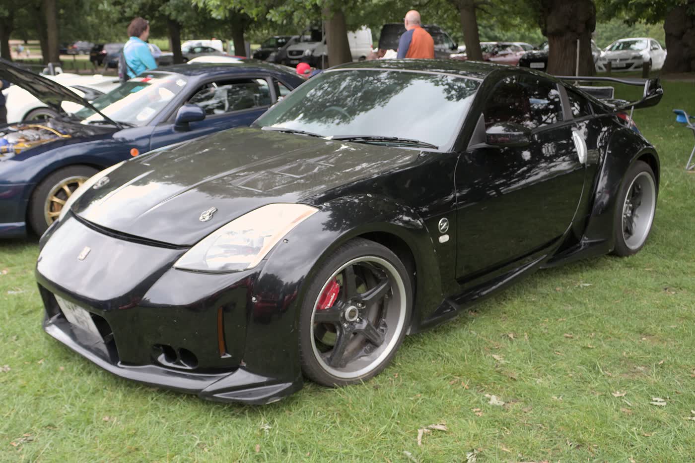 A Nissan 350Z coupe parked at a motor show