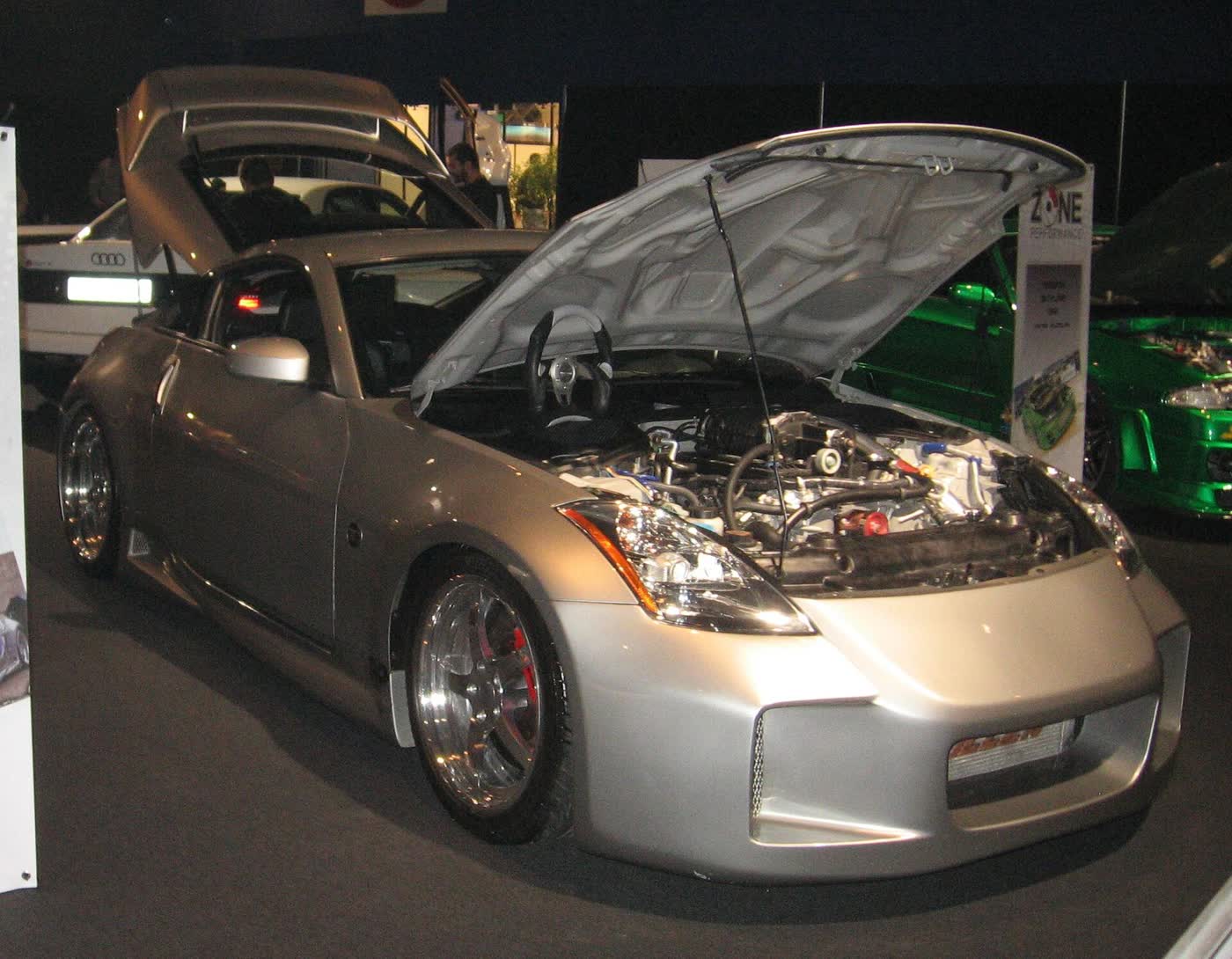 A supercharged and body-kitted Nissan 350Z displayed at a motor show