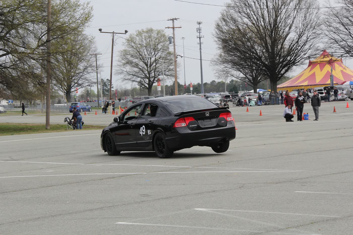 A Honda Civic Si on an autocross course with cones laid out around it