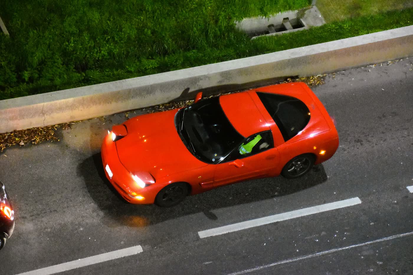 A 2001 Chevrolet Corvette C5 coupe in profile, showing its long hood and fastback roofline