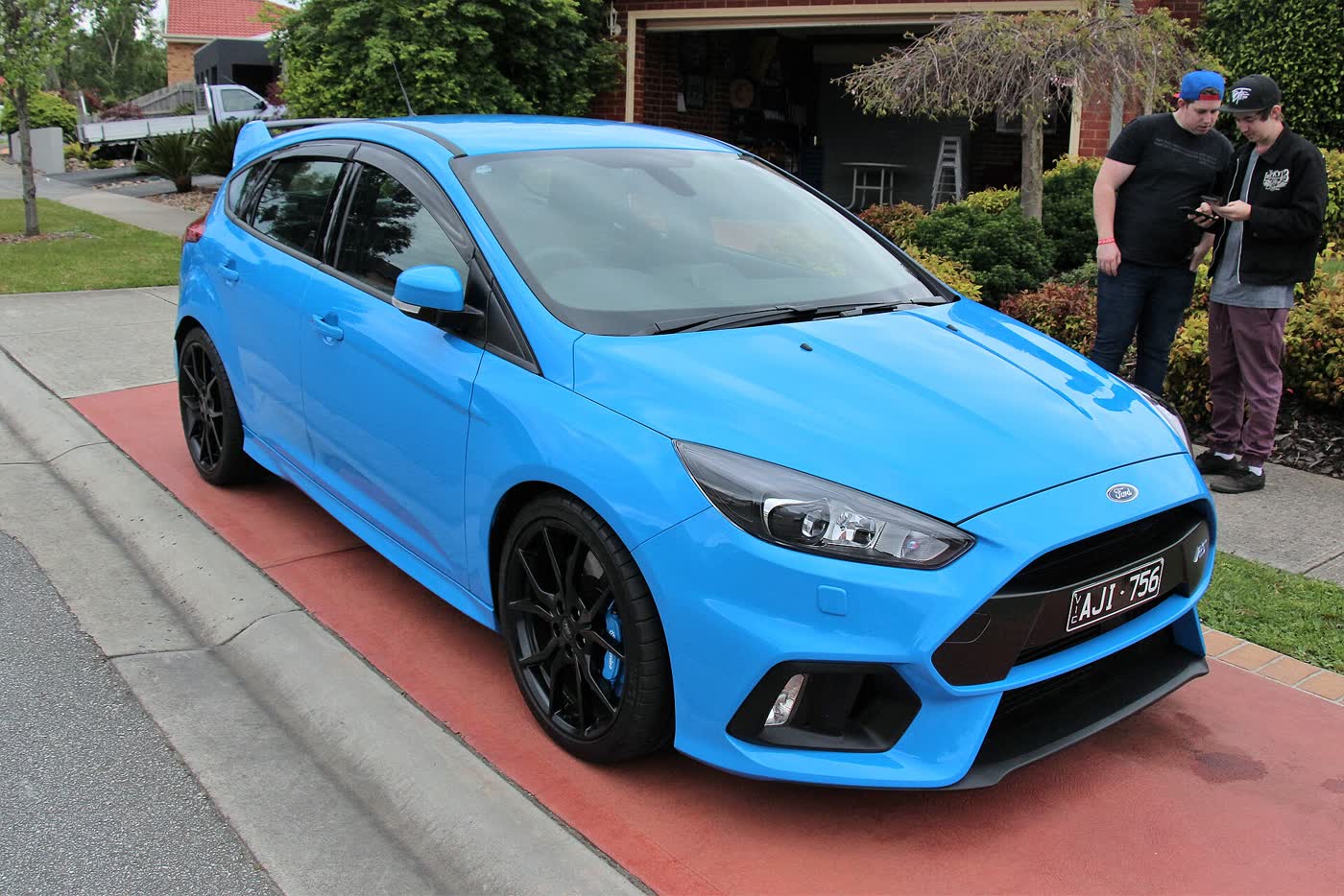 A Nitrous Blue Ford Focus RS Mk3 parked outdoors