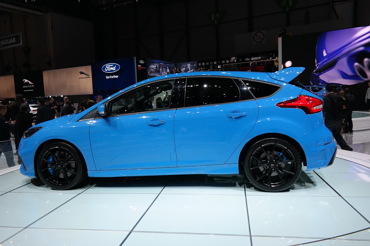A blue Ford Focus RS Mk3 on a motor show stand