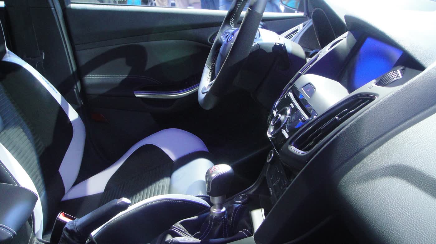 The interior of a Ford Focus ST Mk3, showing the Recaro seats, wheel and centre stack