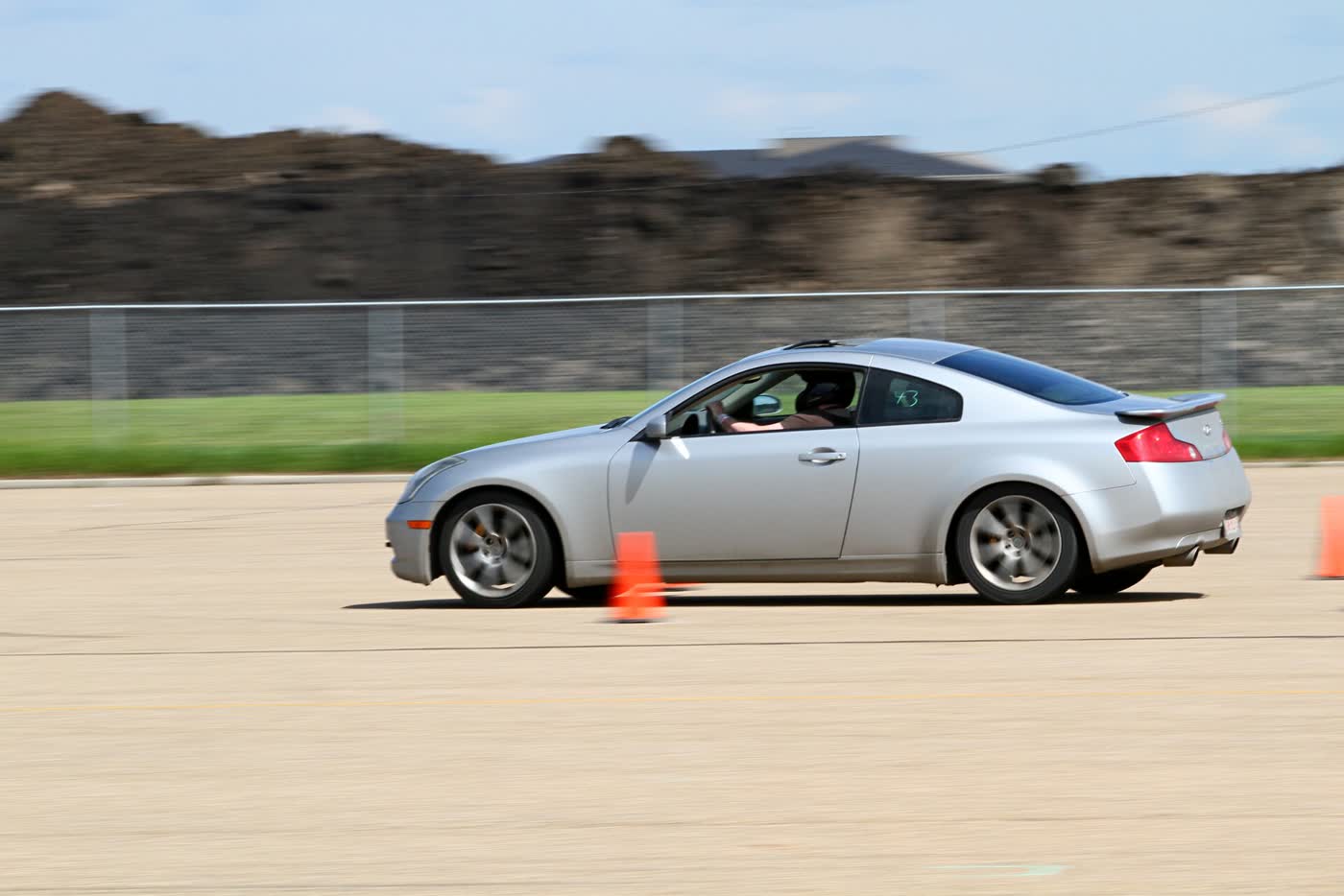 An Infiniti G37 on an autocross course between cones