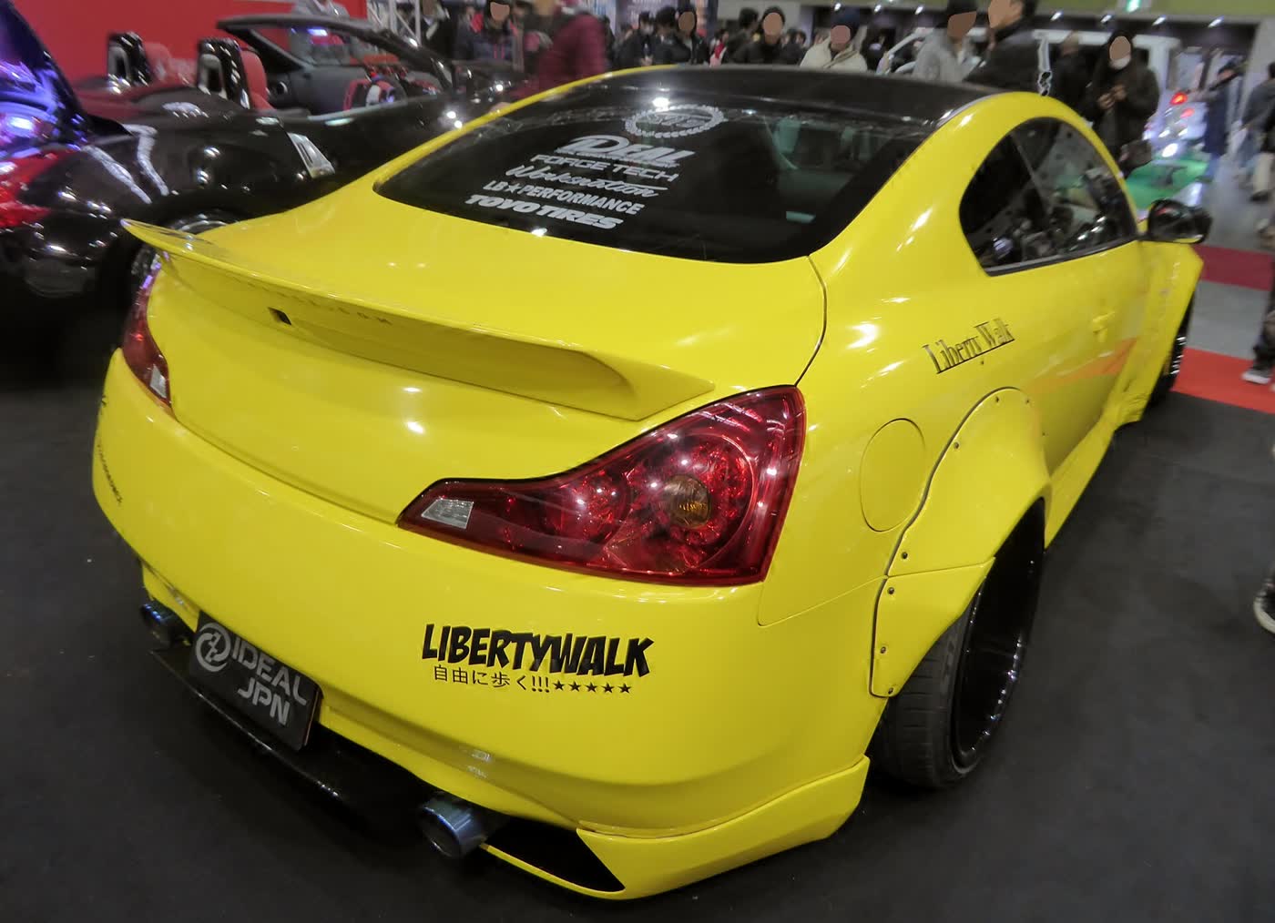A Liberty Walk widebody Infiniti G37 on display at a Japanese car show
