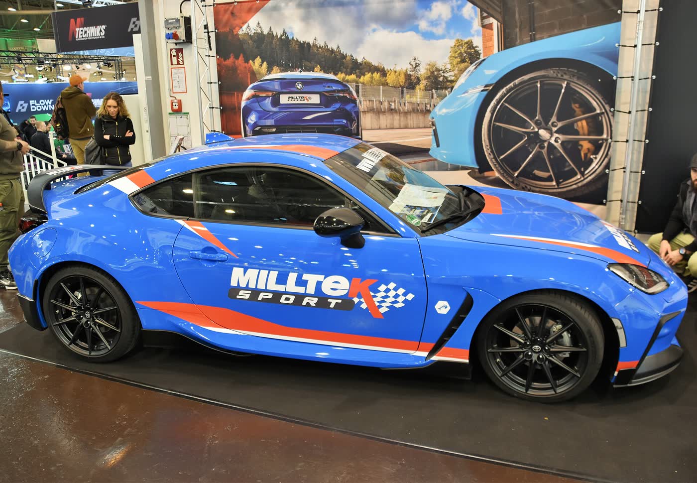 A blue Toyota GR86 coupe, three-quarter view