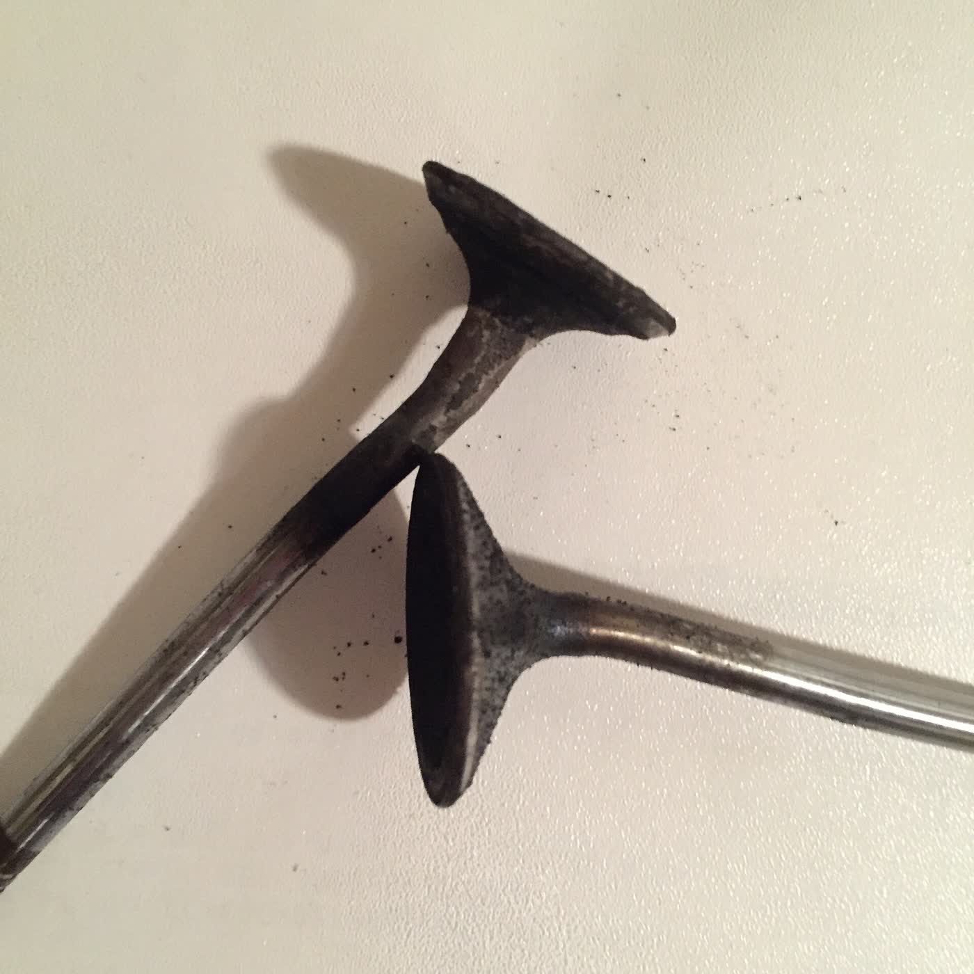 Bent engine valves laid out after a timing chain failure
