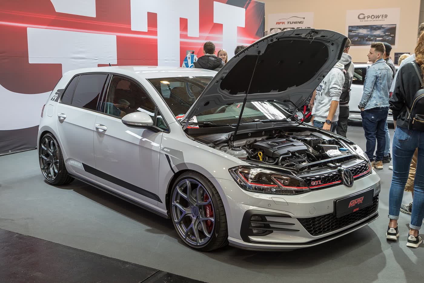 An APR-tuned Volkswagen Golf GTI on display at a tuning show