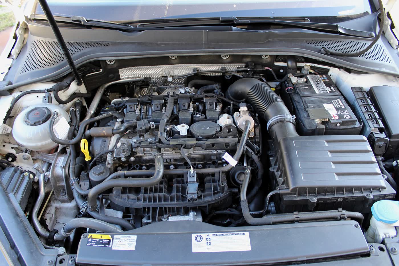 A Volkswagen EA888 Gen 3 two-litre turbo engine on a display stand