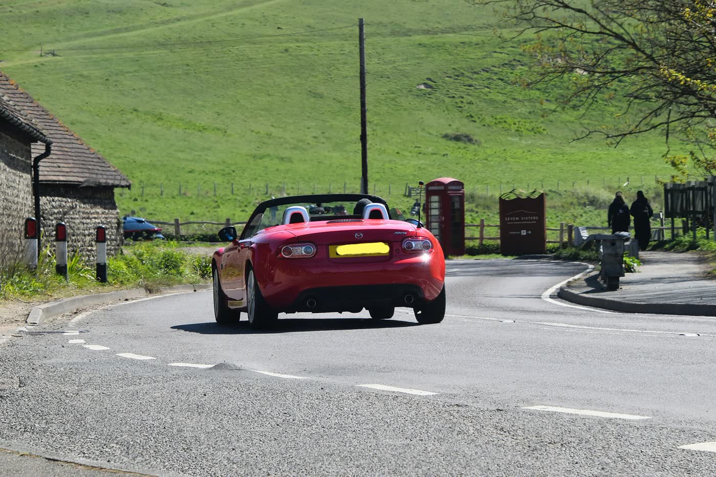 A Mazda MX-5 NC parked, three-quarter view