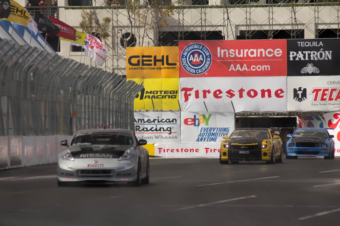 A Nissan 370Z race car on a street circuit during a Pirelli World Challenge round