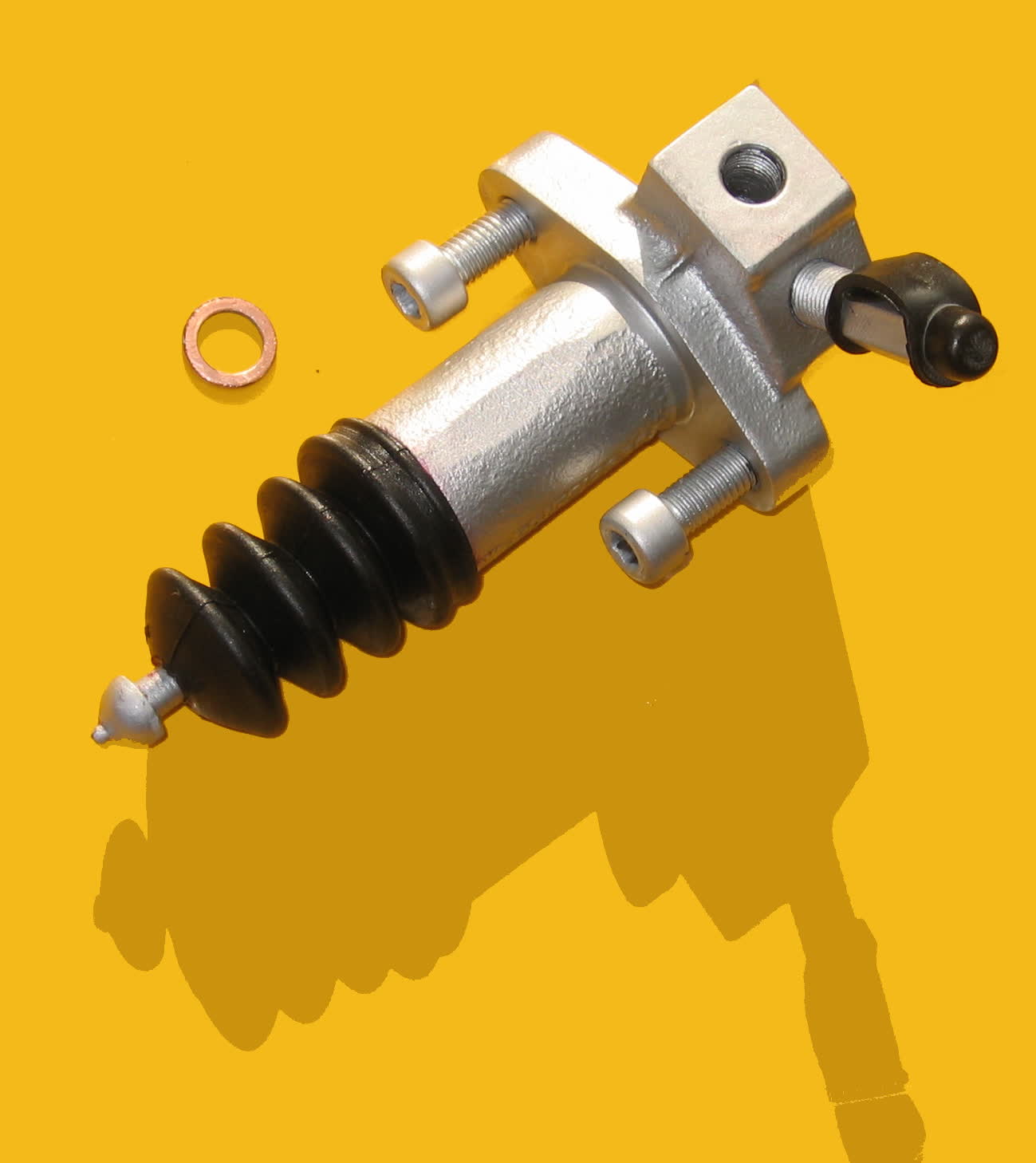A clutch slave cylinder, the concentric type that sits inside the bellhousing, photographed against a plain background