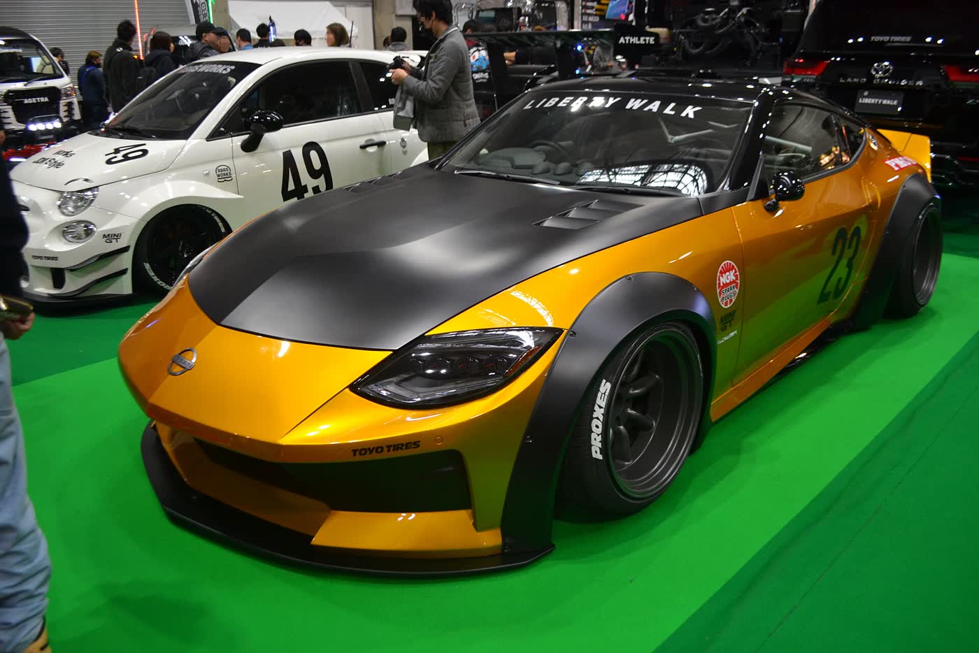 A Liberty Walk widebody Nissan Z RZ34 on display at a car show