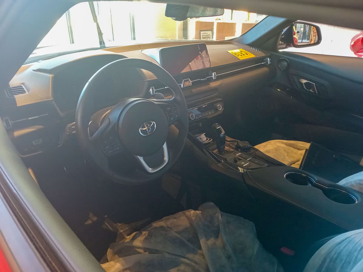 The interior of a 2023 Toyota GR Supra 3.0, showing the dashboard, screen and centre console