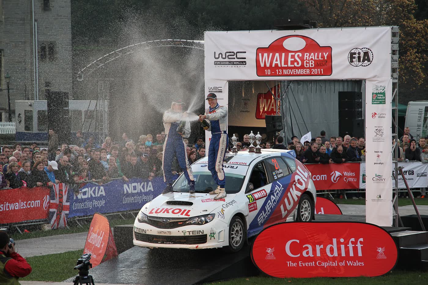 A Subaru Impreza rally car on a gravel stage at Wales Rally GB