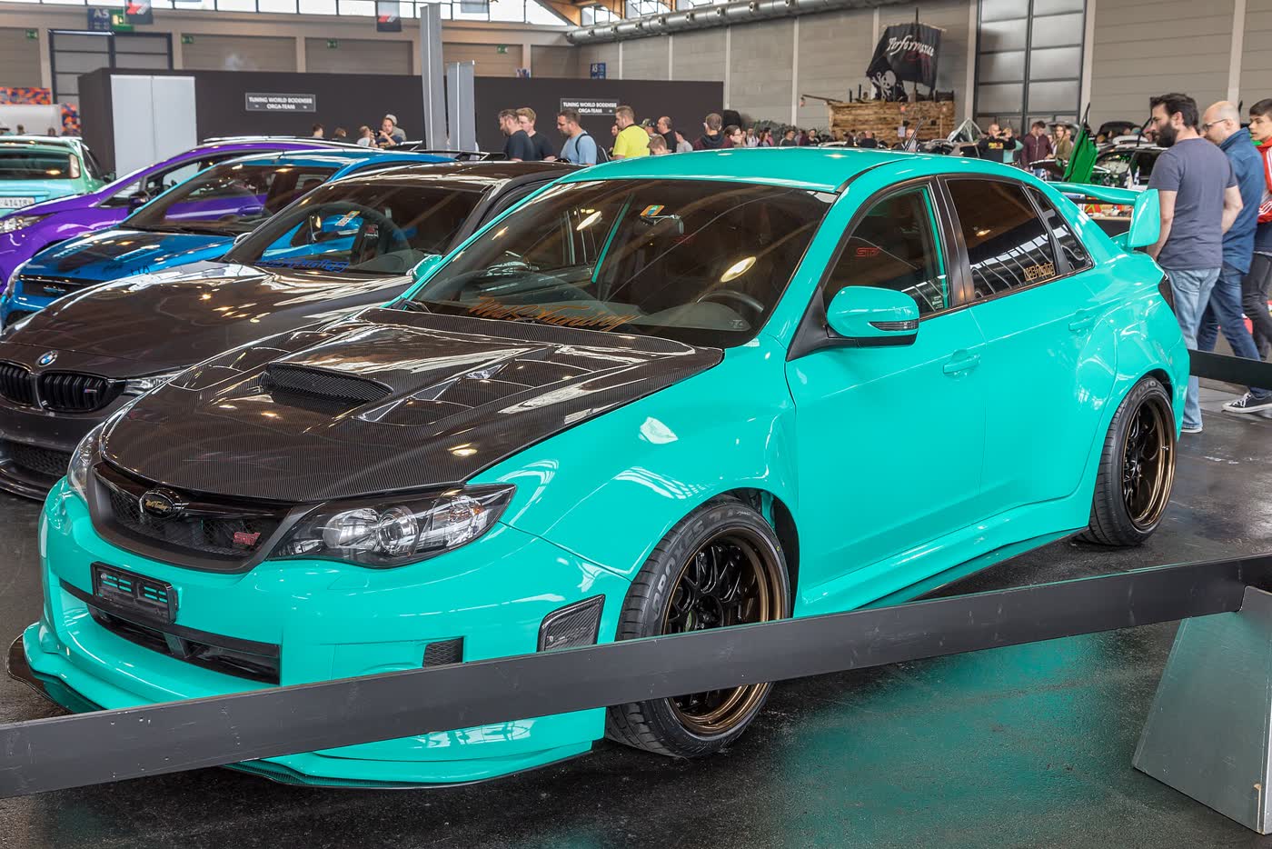 A modified Subaru Impreza at a tuning show