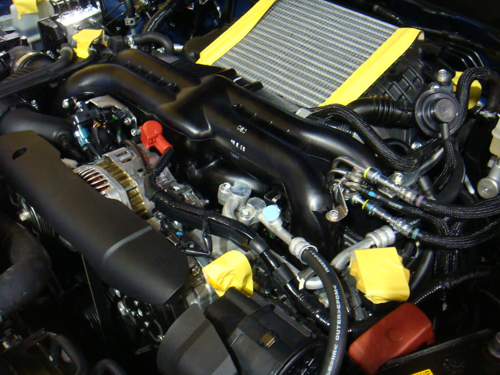 The engine bay of a Subaru Impreza WRX showing the boxer four and its top-mounted intercooler